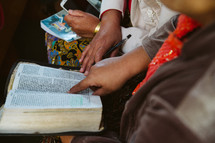 reading a Bible during a worship service 