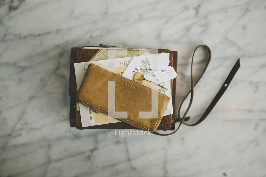 change purse, Bible, journal, dried flower, paper 