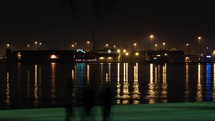 Timelapse of night life on waterfront