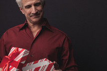 man opening a Christmas present 