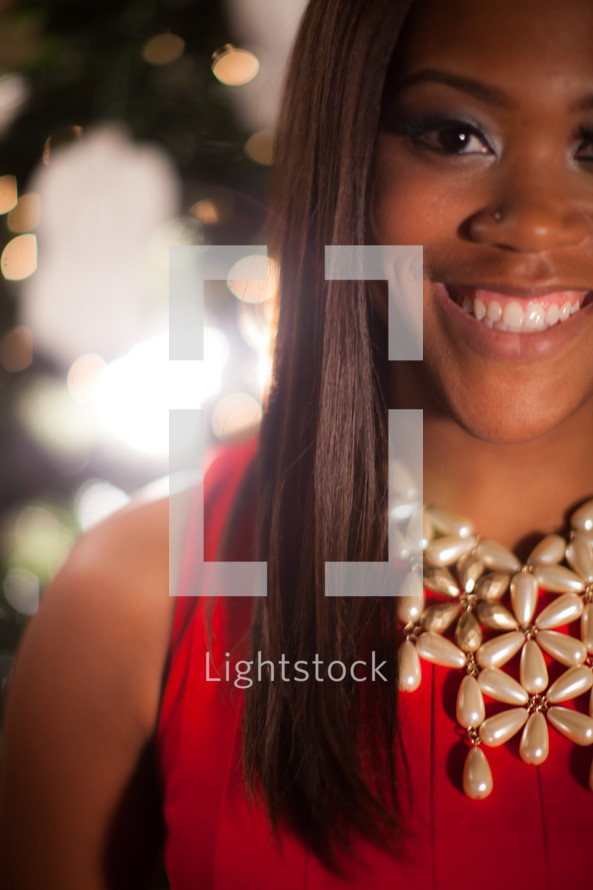 A smiling African-American woman at Christmas 