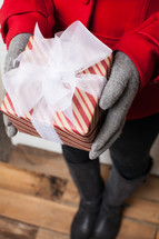 pped, Christmas, gift, present, gloves, red coat, woman, holding