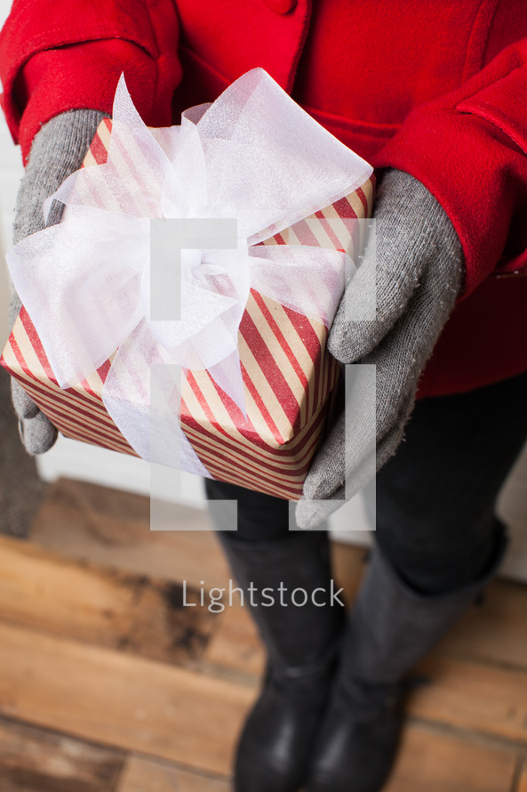 pped, Christmas, gift, present, gloves, red coat, woman, holding