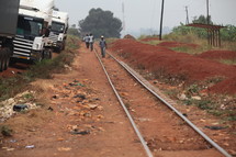 workers walking on railroad tracks