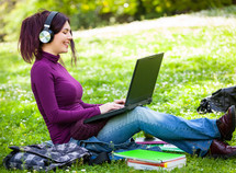 young woman listening music with headphones.