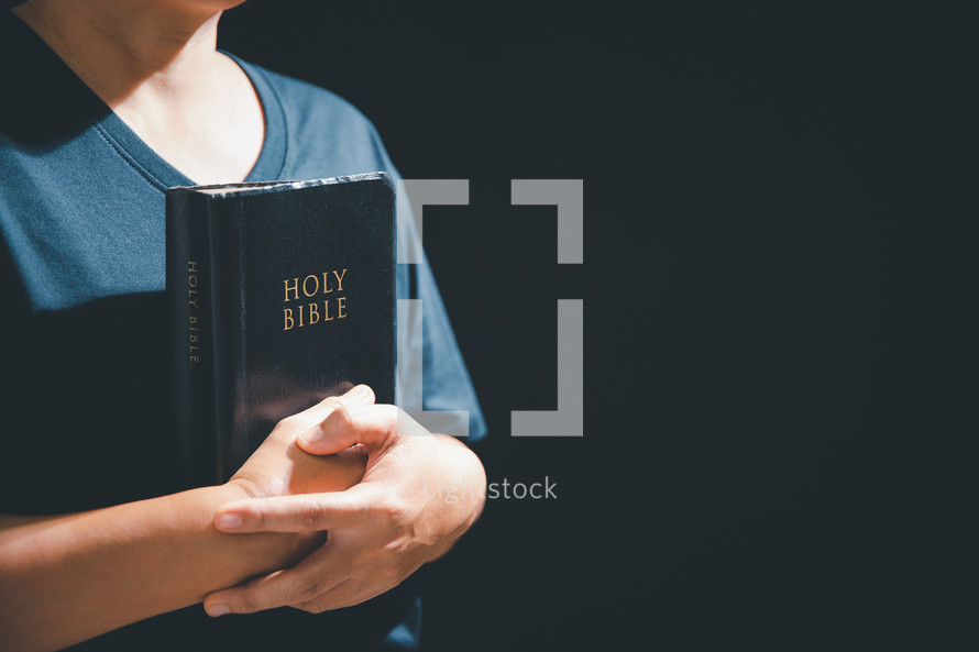 Person holding a bible