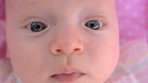Blue-eyed three months baby girl