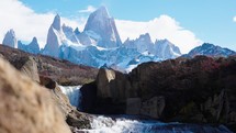 Mount Fitz Roy showing though secret waterfall in Patagonia Argentina, El Chalten town.
