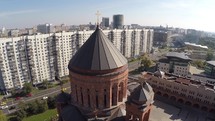Flying over Orthodox church in the city