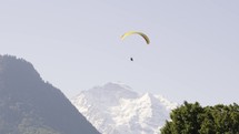 Paraglider in front of mountains