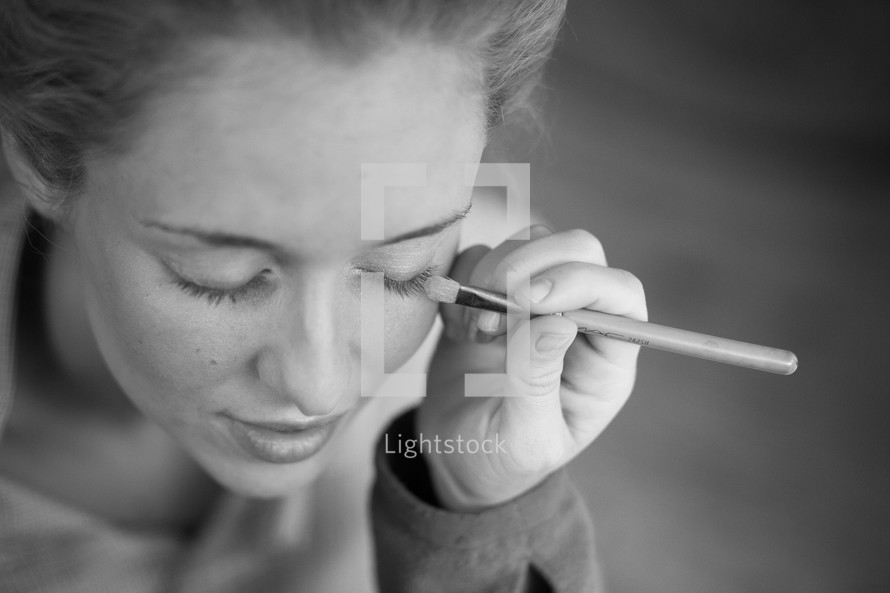 Woman getting makeup done