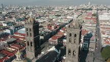 Aerial shot of Puebla Cathedral Bell Towers At Daytime In Puebla's Historic Centre, Mexico. 