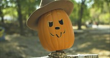 Spooky Halloween, pumpkin scarecrow decoration at pumpkin patch in autumn, fall season.