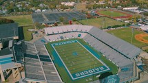 aerial view over a high school football stadium 