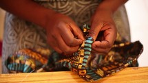 seamstress sewing African fabric in Uganda 