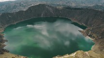 Quilotoa Volcanic Crater Lagoon With Turquoise Waters In Ecuador - aerial drone shot	