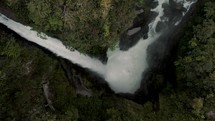 Drone shot of Devil's Cauldron Powerful Waterfall In Baños de Agua Santa, Ecuador.