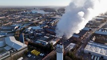 Smoke Bellows From an Industrial Chimney Contributing To Climate Change