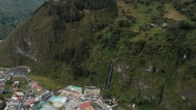Stunning Cascada de la Virgen Flowing Down The Mountain Cliff At Baños de Agua Santa, Ecuador. - aerial	