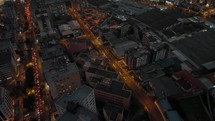 Stunning aerial tilt-up reveals vast Quito city at twilight with traffic	