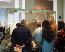 LONDON, UK - CIRCA JUNE 2017: Tourists visiting the Rosetta Stone at British Museum