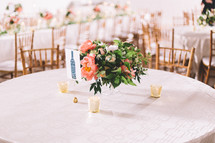 flower arrangement on the center of a table at a wedding reception 