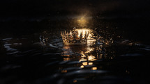 A golden crown is adrift on the water's surface. A lost kingdom to regain. 