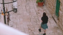 Girl walking in the streets of Italy