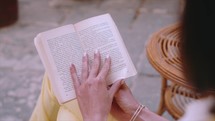 Woman reading in the streets of Italy