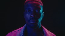 African-American Man Posing in Neon Lights