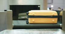 luggage on a conveyor belt at the airport