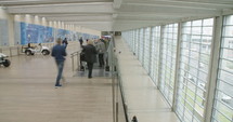 Time lapse of passengers going through a large airport terminal