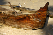 boat with oars on a beach in the sand 