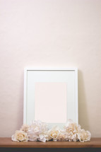 blank sign in a frame with flowers 