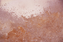 Orange rock/water/ice texture background 
