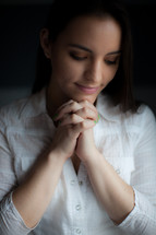 brunette woman in prayer 