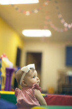 infant girl in a church nursery