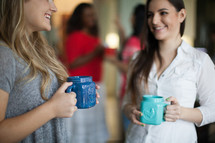 women in conversation and drinking coffee at a women's group 