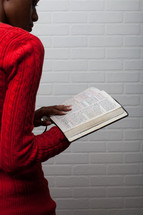 African-American woman reading a Bible 