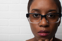 face of an African-American woman with reading glasses 