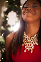 an African-American woman with her face turned to God at Christmas 