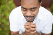 man in reverent prayer 