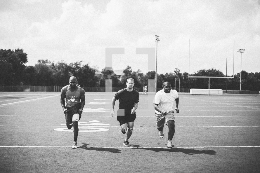 men running at a sports practice