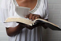 torso, African-American woman reading a Bible 