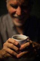 man drinking a cup of coffee in the morning 