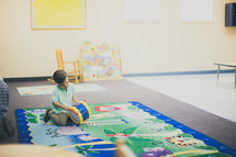 child playing in a church nursery