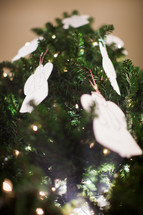 angel ornaments on a Christmas tree