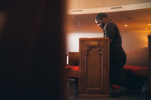 man in prayer in a church