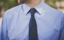 torso of a man in a tie