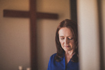 woman in prayer in a church 